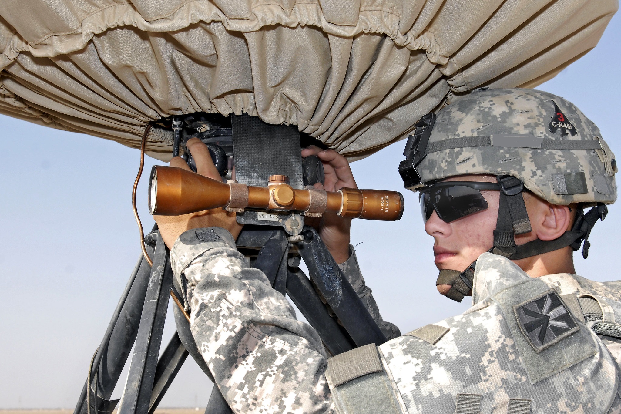 Soldier looking through scope
